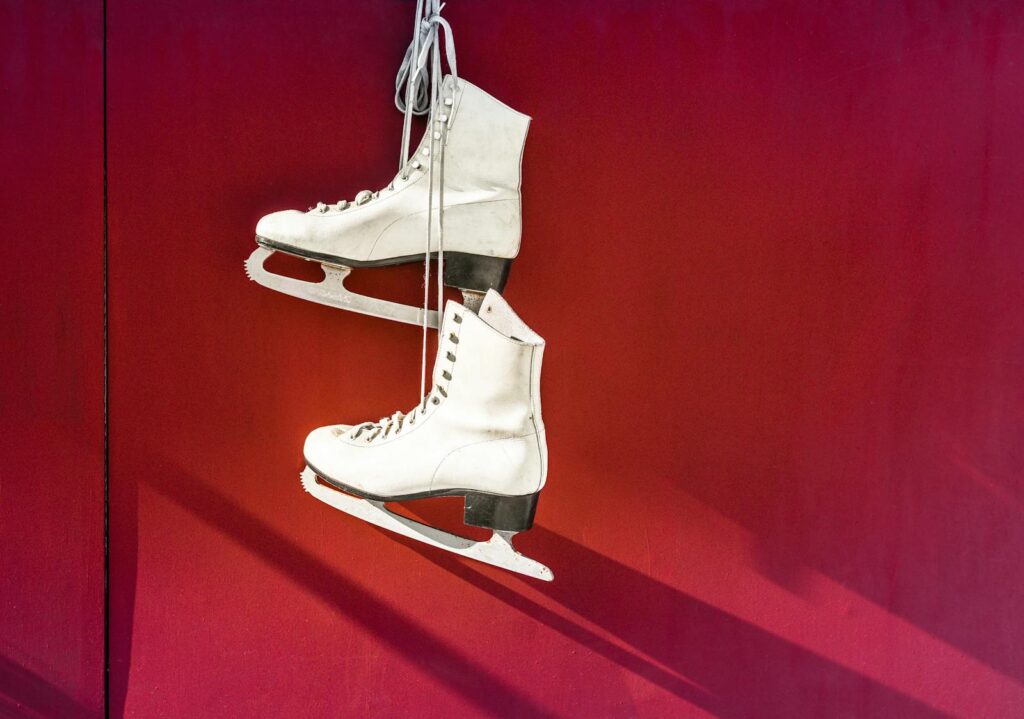 Hanged Pair of White Leather Figure Skates